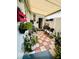 Outdoor patio featuring checkered tile, an awning, and potted plants, creating a relaxing outdoor space at 2862 Grasmere View Pkwy, Kissimmee, FL 34746
