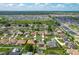 Wide shot of community with residential landscape, featuring green areas and natural lighting at 301 Terranova Blvd, Winter Haven, FL 33884