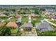Community view showcasing neighborhood and houses surrounded by lush landscapes and green lawns at 301 Terranova Blvd, Winter Haven, FL 33884