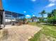 There is a covered patio and an outdoor pergola in this backyard at 301 Terranova Blvd, Winter Haven, FL 33884