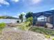 This backyard features a covered patio with spa and an outdoor pergola at 301 Terranova Blvd, Winter Haven, FL 33884
