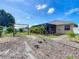 Relaxing backyard featuring a screened lanai, creating a private and enjoyable outdoor living space at 301 Terranova Blvd, Winter Haven, FL 33884