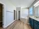 Bathroom boasts a tub, tiled floors, and a tiled stand up shower at 301 Terranova Blvd, Winter Haven, FL 33884