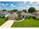 Inviting single-story home with lush landscaping and a well-manicured lawn at 301 Terranova Blvd, Winter Haven, FL 33884