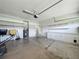 The garage features built in shelving, cabinets and an entrance to the home at 301 Terranova Blvd, Winter Haven, FL 33884
