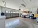 The garage has a new roll up door and open shelves for storage at 301 Terranova Blvd, Winter Haven, FL 33884