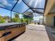 This covered patio with spa has great backyard views at 301 Terranova Blvd, Winter Haven, FL 33884