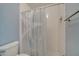 Freshly renovated white bathroom features a blue accent wall, white subway tile, and shower at 3205 Sabal Palms Ct # A, Kissimmee, FL 34747
