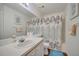 Bathroom view with mirror, a sink, a shower, and white cabinets at 3205 Sabal Palms Ct # A, Kissimmee, FL 34747