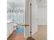 Bathroom view with a blue rug and decorative shower curtain at 3205 Sabal Palms Ct # A, Kissimmee, FL 34747