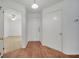 Bright entryway boasts wood floors, white door, and a glimpse into the adjacent room at 3205 Sabal Palms Ct # A, Kissimmee, FL 34747