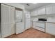 The kitchen area includes a laundry closet, a refrigerator, and an oven with stove top at 3205 Sabal Palms Ct # A, Kissimmee, FL 34747