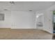 Spacious living room with carpet, ceiling fan, and an open doorway to another room at 3205 Sabal Palms Ct # A, Kissimmee, FL 34747
