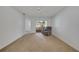 Spacious living room with carpet, ceiling fan, and sliding glass doors to the porch at 3205 Sabal Palms Ct # A, Kissimmee, FL 34747