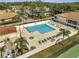 Aerial view of the community pool and sunbathing chairs at 3205 Sabal Palms Ct # A, Kissimmee, FL 34747