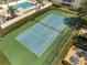 Overhead view of the community tennis court with the pool in the background at 3205 Sabal Palms Ct # A, Kissimmee, FL 34747