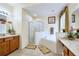 Bright bathroom with a separate shower and bathtub, plus dual vanities at 344 Cherokee Ave, Haines City, FL 33844