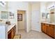 Well-lit bathroom boasts dual sinks, a separate toilet room, and ample counter space at 344 Cherokee Ave, Haines City, FL 33844