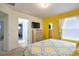Bright, sunny bedroom features a TV, a mirror, and comfortable decor at 344 Cherokee Ave, Haines City, FL 33844