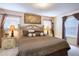 Inviting bedroom with zebra comforter, a cozy atmosphere, and two bedside tables at 344 Cherokee Ave, Haines City, FL 33844