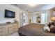 Bedroom with decorative dresser, a mounted television, and a unique mirror at 344 Cherokee Ave, Haines City, FL 33844