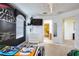 Star Wars themed bedroom featuring a black accent wall and view into the bathroom at 344 Cherokee Ave, Haines City, FL 33844