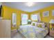 Cheery bedroom in yellow with decorative curtains, natural light, and modern dresser at 344 Cherokee Ave, Haines City, FL 33844