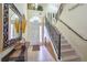 Inviting entryway featuring tile floors, staircase with wrought iron railing, and decorative accents at 344 Cherokee Ave, Haines City, FL 33844