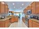 Spacious kitchen featuring stainless steel appliances, granite countertops, and ample cabinet space at 344 Cherokee Ave, Haines City, FL 33844