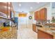Bright kitchen with granite countertops, stainless steel appliances, and ample cabinet space at 344 Cherokee Ave, Haines City, FL 33844