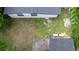 Aerial view shows a backyard and a shed on the side at 3524 Hage Way, Orlando, FL 32805