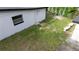 The backyard has a shed, a white building and grass at 3524 Hage Way, Orlando, FL 32805