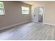 Spacious bedroom with wood-look floors and ensuite bathroom at 3524 Hage Way, Orlando, FL 32805