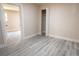 Bedroom featuring light walls, wood floors, an open closet and lots of natural light at 3524 Hage Way, Orlando, FL 32805