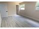 Bright bedroom featuring wood-look floors and a window at 3524 Hage Way, Orlando, FL 32805