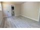 Bedroom featuring light walls, wood floors, and attached bathroom at 3524 Hage Way, Orlando, FL 32805