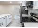 Bright kitchen with white cabinets, stainless steel appliances, and light countertops at 3524 Hage Way, Orlando, FL 32805
