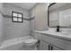 Bathroom featuring tub, toilet and modern vanity at 3623 Tree Line Way, St Cloud, FL 34769