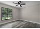 Bedroom features luxury vinyl plank flooring and a window at 3623 Tree Line Way, St Cloud, FL 34769