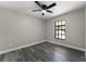 This bedroom features luxury vinyl plank flooring, a window and neutral paint at 3623 Tree Line Way, St Cloud, FL 34769