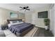 Stylish bedroom featuring a ceiling fan, calming decor and neutral color palette at 3623 Tree Line Way, St Cloud, FL 34769