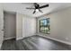 This bedroom features a ceiling fan, closet, and window for natural light at 3623 Tree Line Way, St Cloud, FL 34769