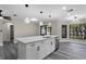 Modern kitchen with stainless steel appliances and a large island, great for entertaining and cooking at 3623 Tree Line Way, St Cloud, FL 34769
