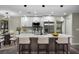 Modern kitchen featuring a large island, stainless steel appliances, and sleek, updated lighting fixtures at 3623 Tree Line Way, St Cloud, FL 34769