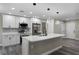 Updated kitchen with white cabinetry, stainless steel appliances, a central island and lots of space at 3623 Tree Line Way, St Cloud, FL 34769