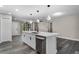 Open concept kitchen with island, dishwasher, and modern design, seamlessly connecting to living area at 3623 Tree Line Way, St Cloud, FL 34769
