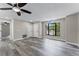 Spacious living room featuring a ceiling fan and lots of natural light at 3623 Tree Line Way, St Cloud, FL 34769