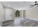 Bright living room features luxury vinyl plank flooring, large window, and ceiling fan at 3623 Tree Line Way, St Cloud, FL 34769