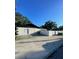 Backyard with fence and large driveway at 400 Vermont Ave, St Cloud, FL 34769