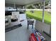 Large backyard with a covered patio and outdoor seating, perfect for relaxation at 400 Vermont Ave, St Cloud, FL 34769